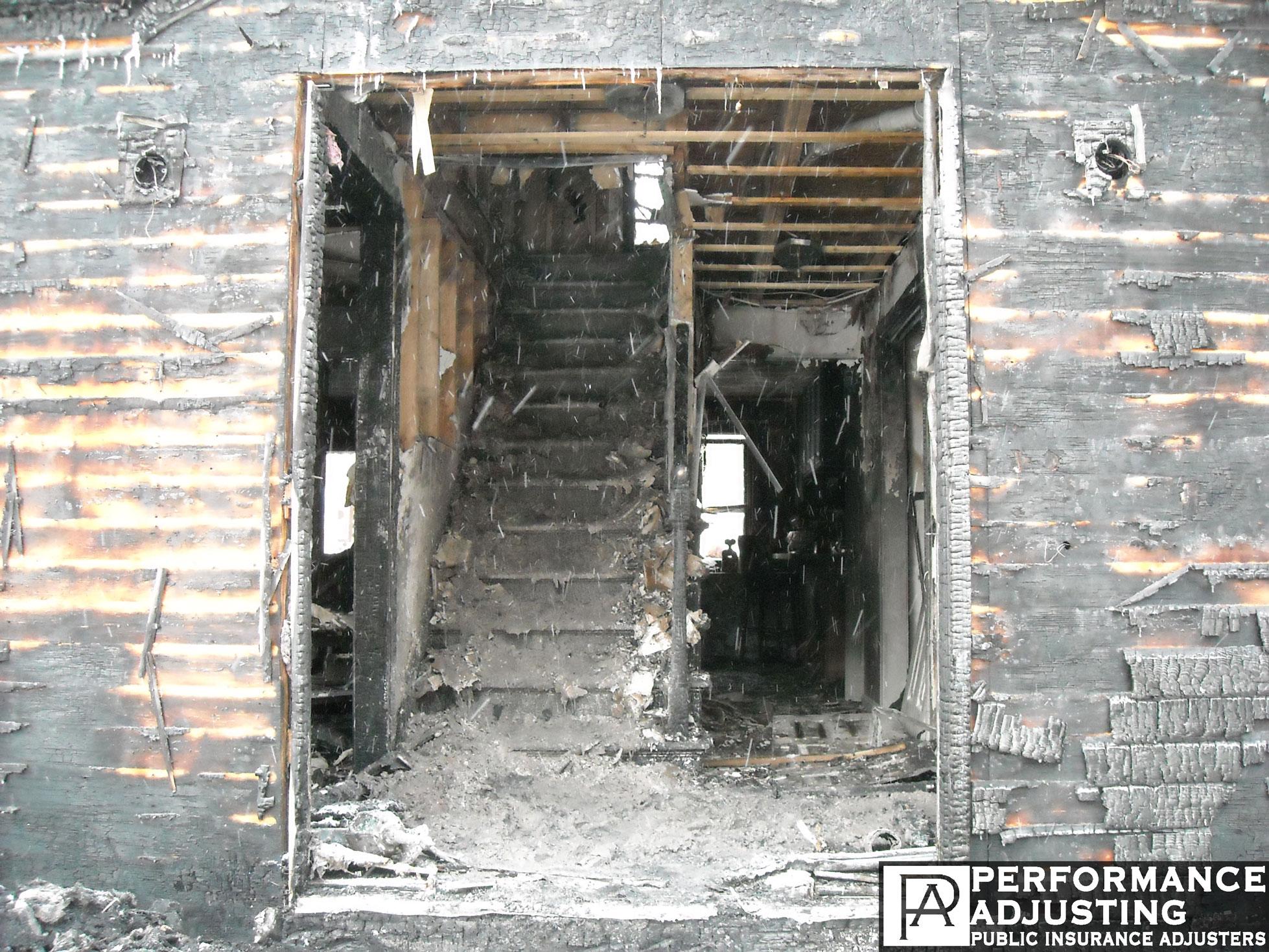 a burned building covered in ash after a fire