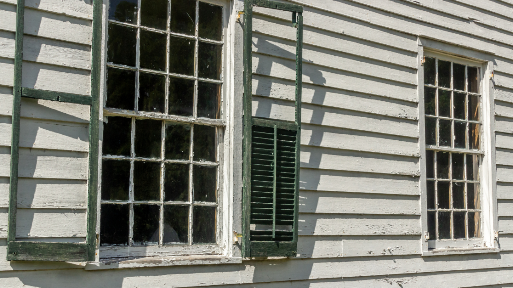 damaged siding due to poor upkeep on home in rhode island